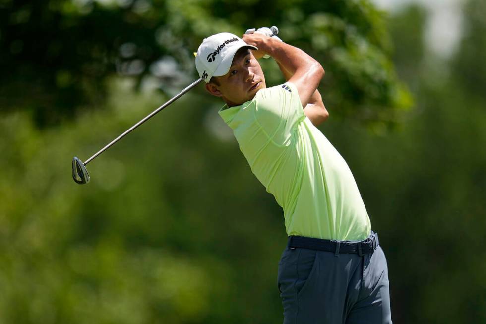 Collin Morikawa hits from the fifth tee during the final round of the Memorial golf tournament, ...