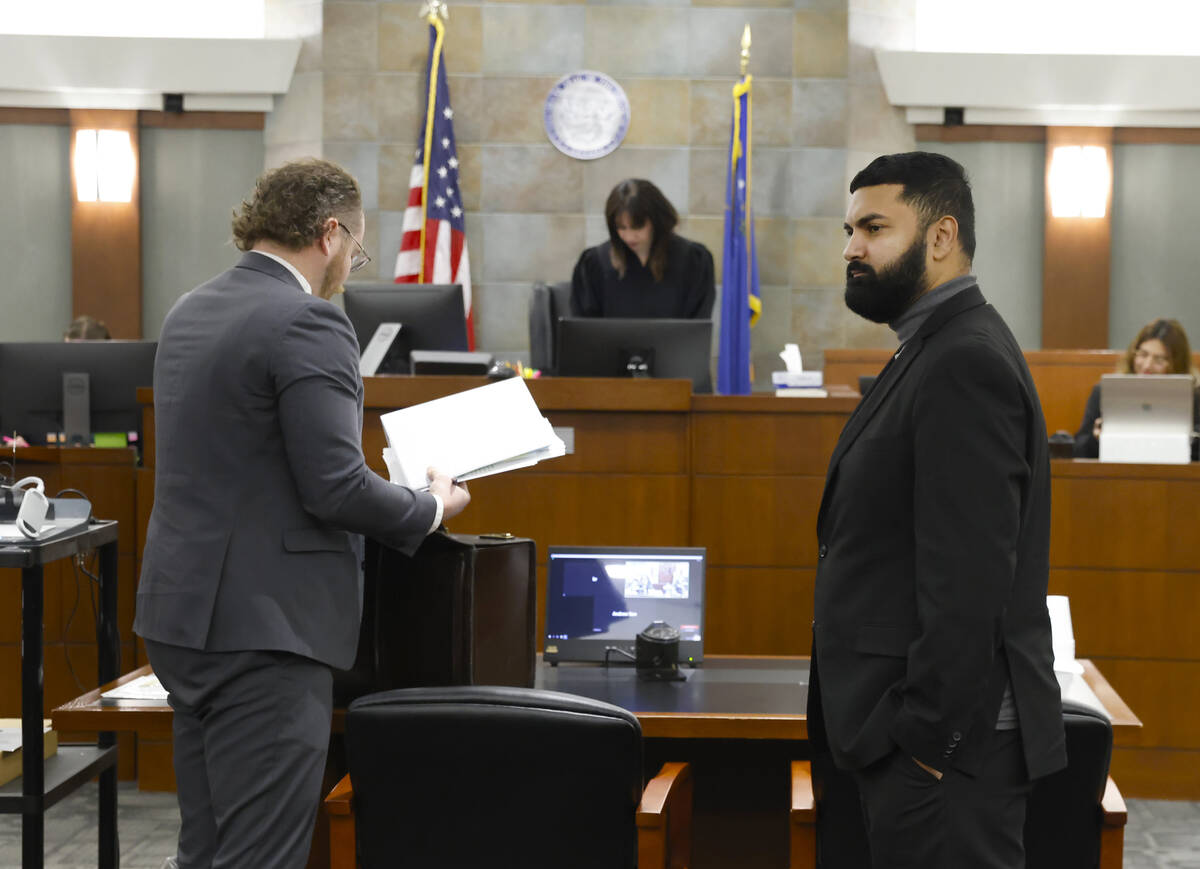 Athar Haseebullah, right, executive director of ACLU of Nevada, attorney Jacob Smith, left, rep ...