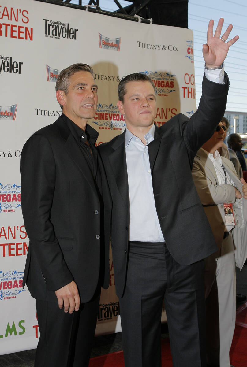 Actors Matt Damon, right, and George Clooney arrive at the CineVegas opening night premiere of ...
