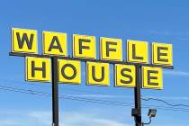 A Waffle House sign is shown in Indianapolis Feb. 19, 2024. Waffle House is increasing pay for ...
