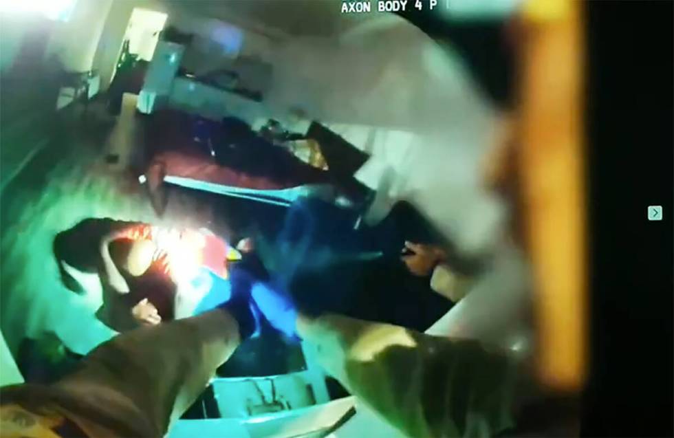 Video from an officer-worn camera shows Maurice Smith attacking a woman before he was shot by M ...