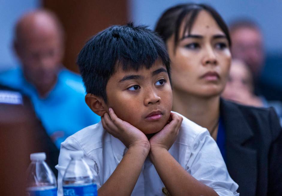 Aries Felix and his mother Arlene Felix listen to victim statements during the sentencing for J ...