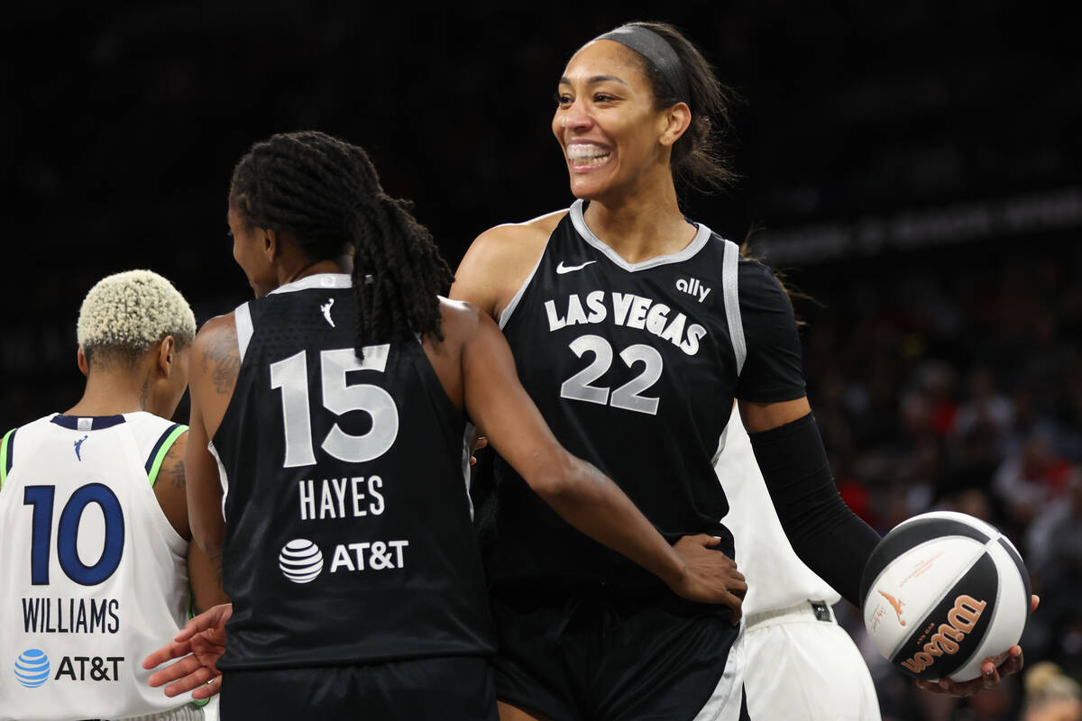Las Vegas Aces center A'ja Wilson (22) and guard Tiffany Hayes (15) celebrate after scoring dur ...