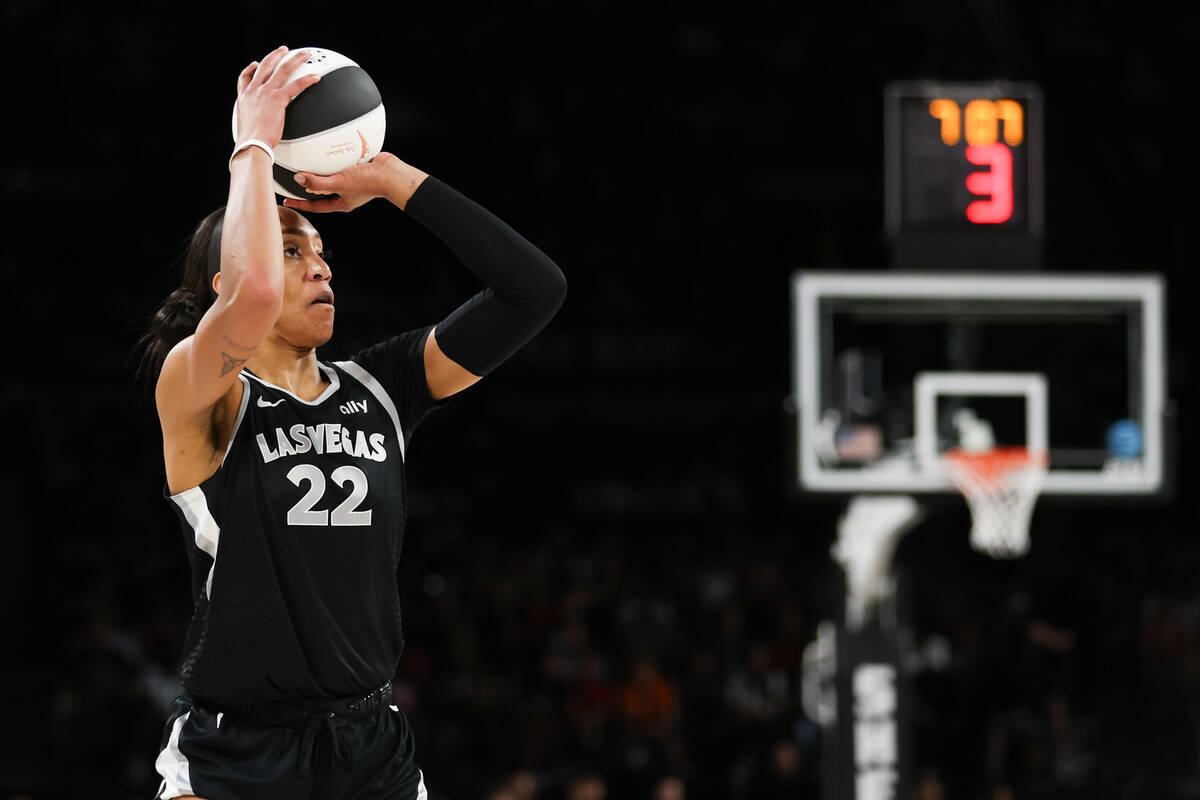 Las Vegas Aces center A'ja Wilson (22) shoots a three-point basket during the first half of a W ...