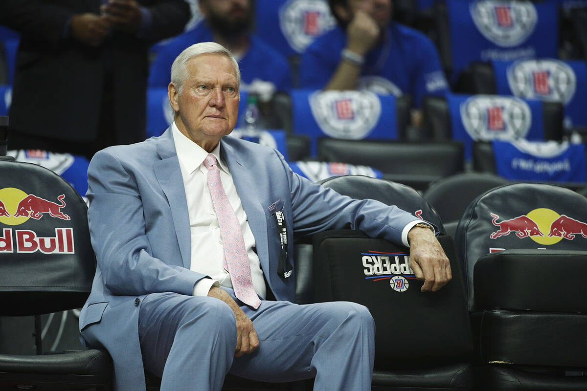 Jerry West sits on the bench before an NBA basketball game between the Los Angeles Clippers and ...