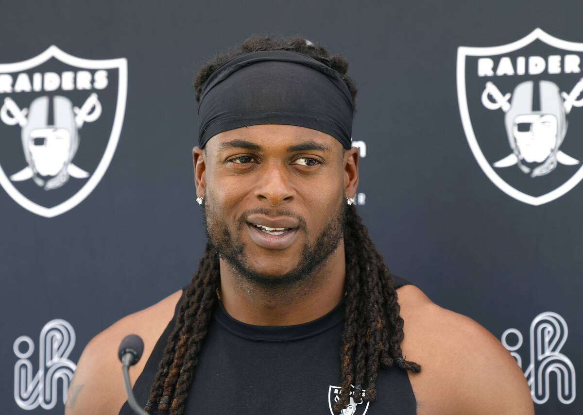 Raiders wide receiver Davante Adams addresses the media after an NFL football practice at the I ...