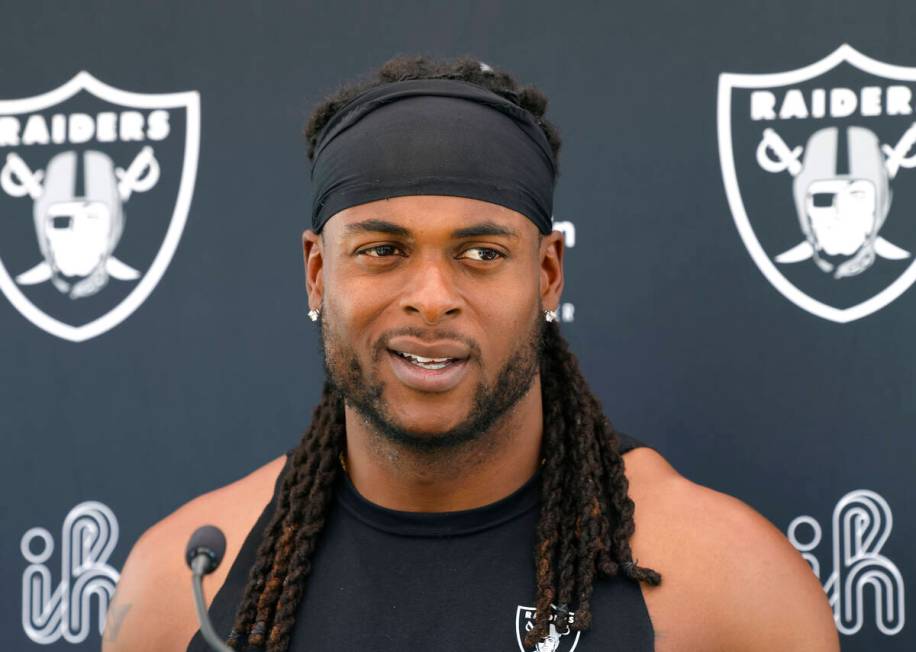 Raiders wide receiver Davante Adams addresses the media after an NFL football practice at the I ...