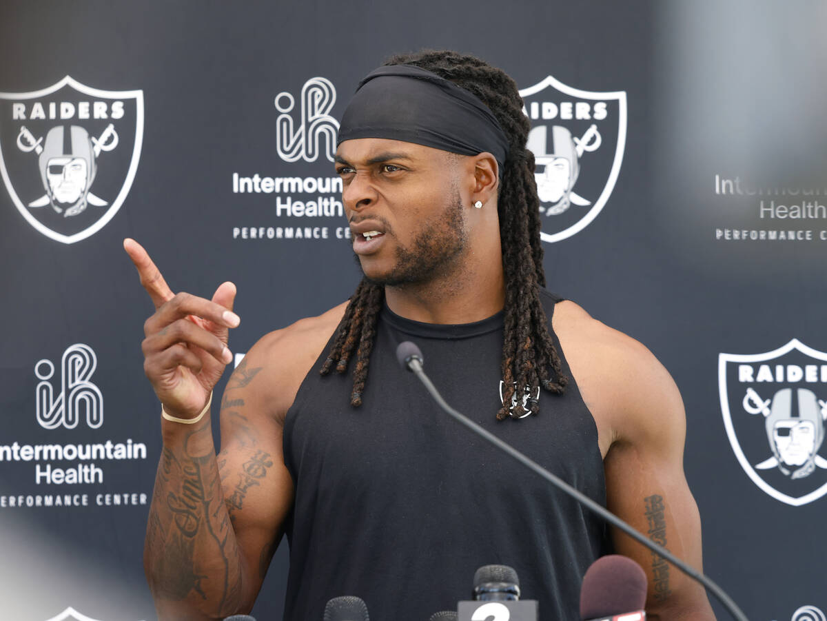 Raiders wide receiver Davante Adams addresses the media after an NFL football practice at the I ...