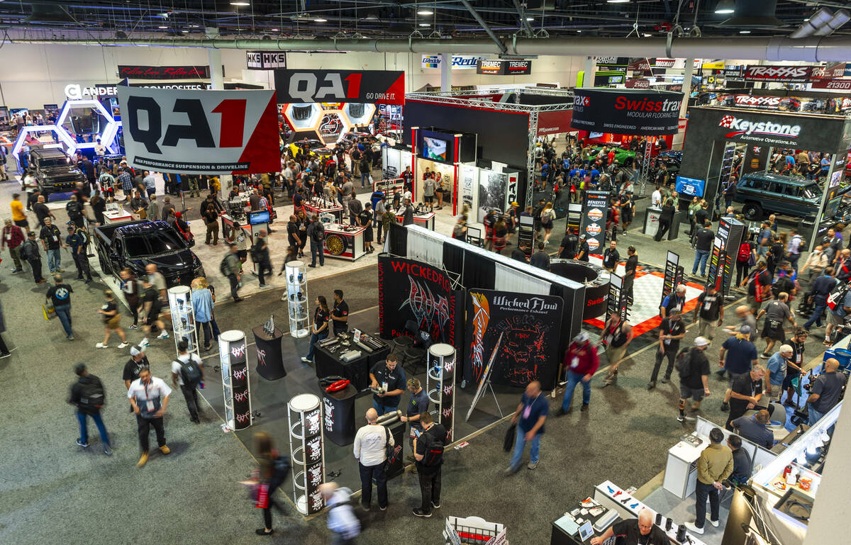 Attendees wander about the South Hall during the second day of SEMA at the Las Vegas Convention ...