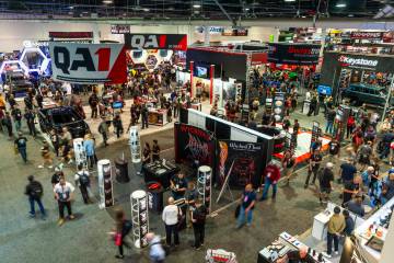 Attendees wander about the South Hall during the second day of SEMA at the Las Vegas Convention ...