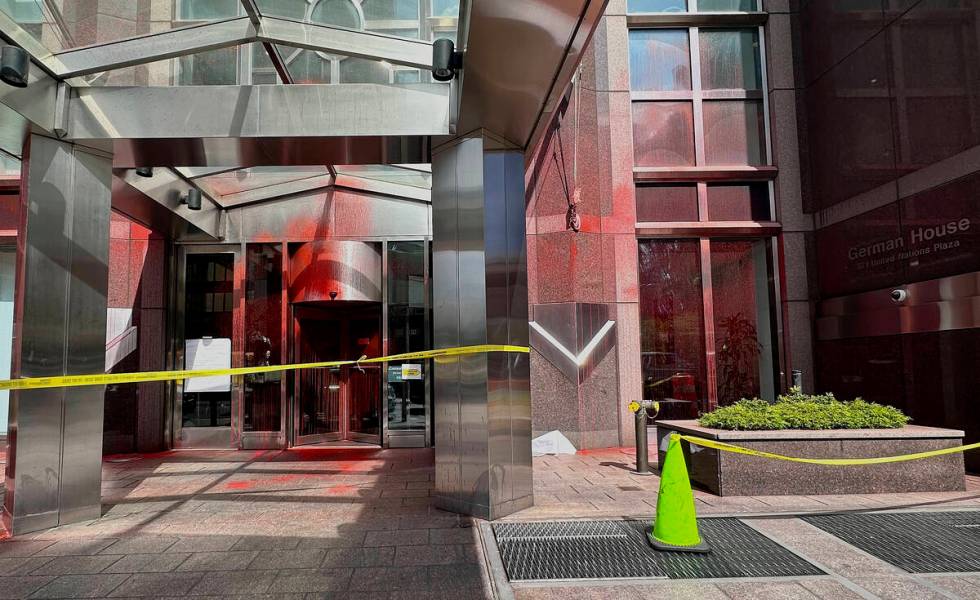 Red paint covers portions of the entrance to the German consulate building, Wednesday, June 12, ...