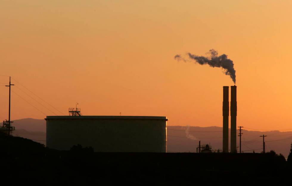 An oil refinery is seen in 2006 at sunset in Rodeo, Calif. (AP Photo/Rich Pedroncelli, file)