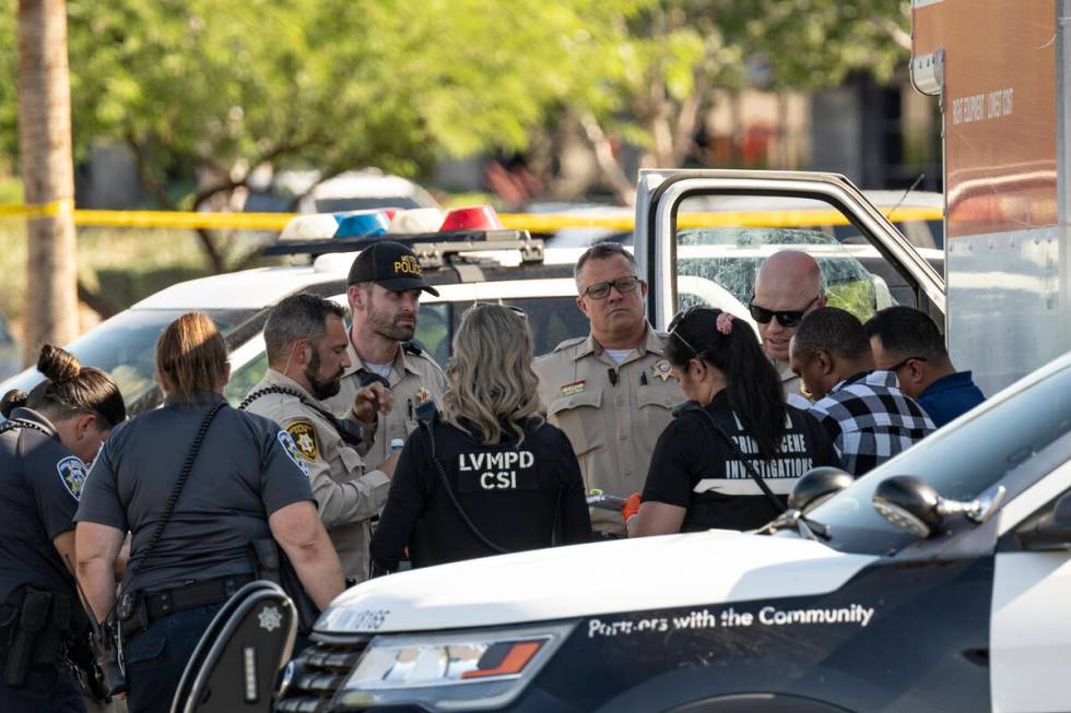 Las Vegas police investigate the scene where they found the bodies of several animals inside a ...