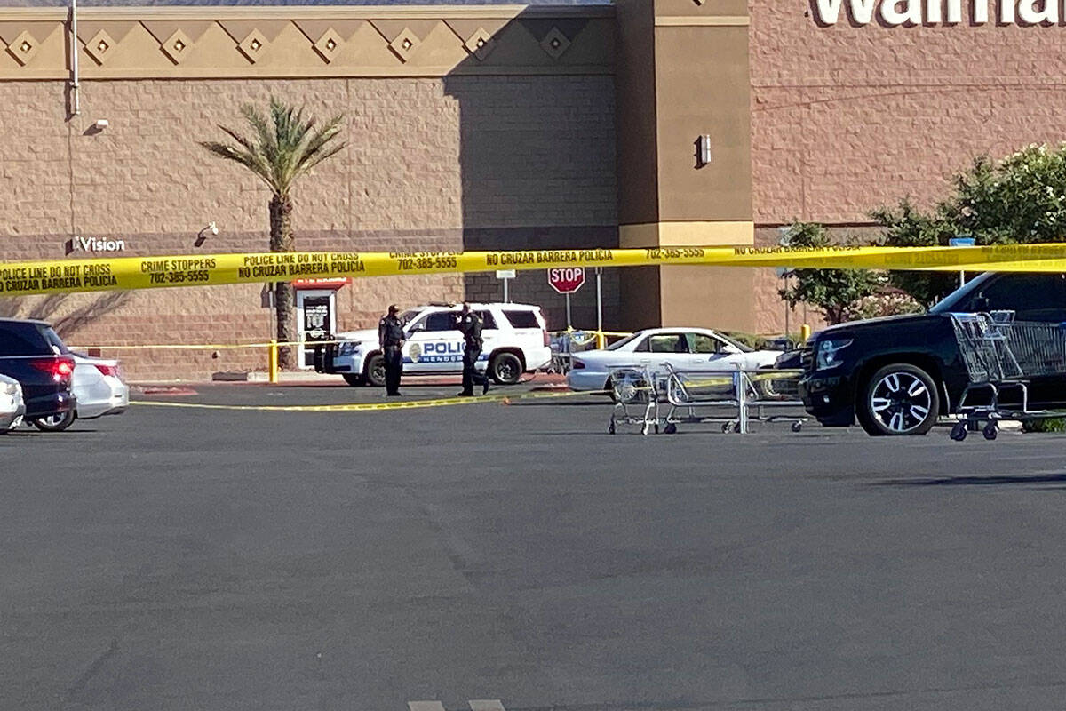 A broken window in a white vehicle is visible near a Walmart in the 500 block of Marks Street i ...