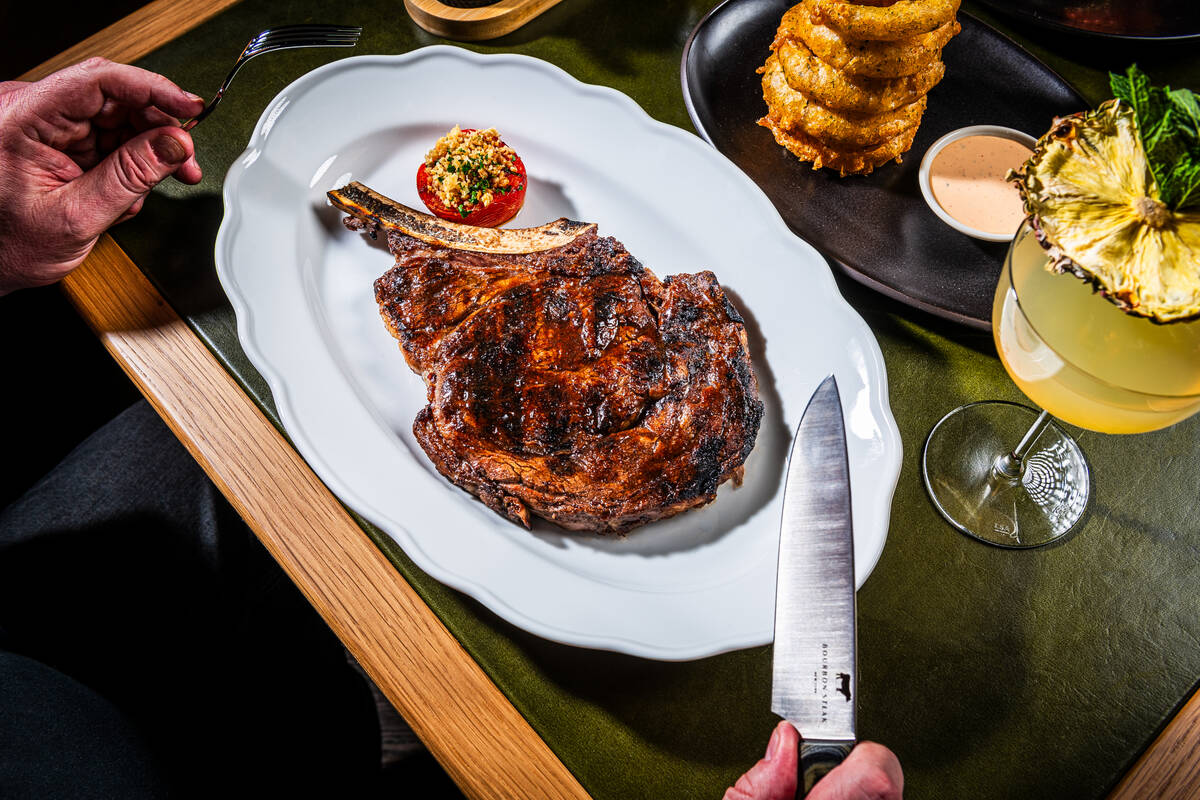 A bone-in ribeye appears on the menu at Bourbon Steak, a restaurant from celebrated chef Michae ...