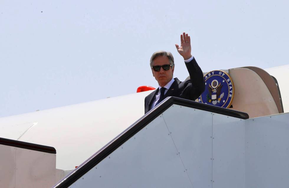 US Secretary of State Antony Blinken disembarks from an airplane as he arrives in Doha, Qatar, ...