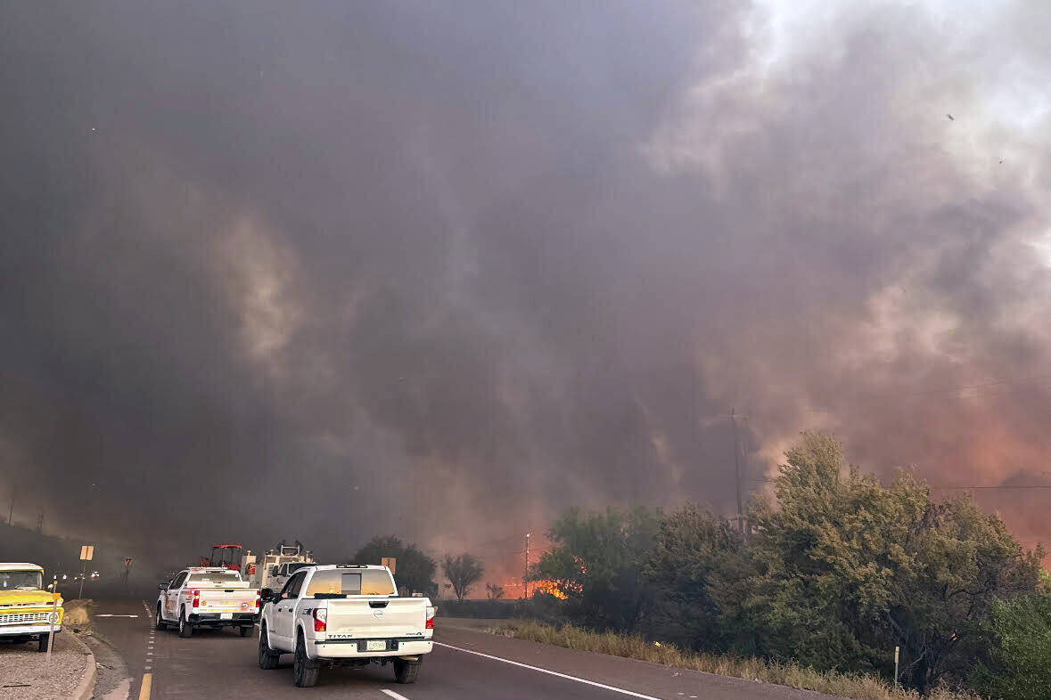 This image shows smoke and flames from the Rose Fire burning southeast of Wickenburg, Ariz., We ...