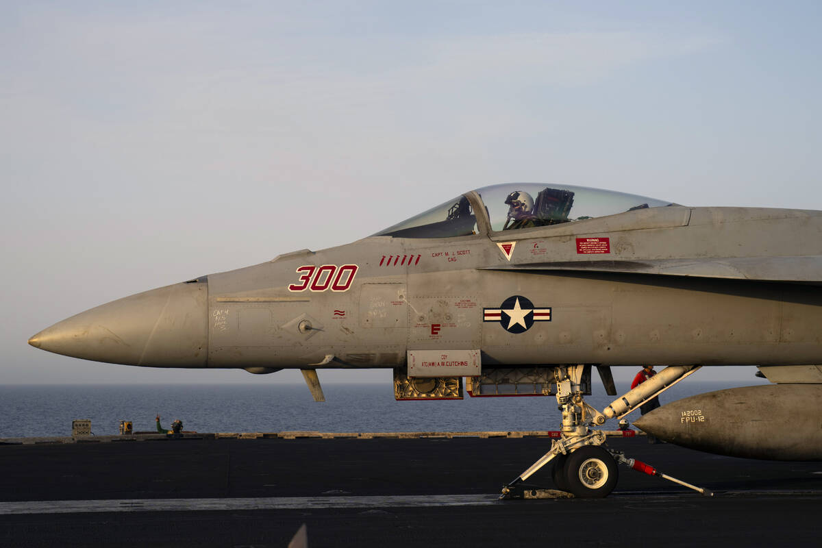 A fighter jet takes off from the USS aircraft carrier Dwight D. Eisenhower, also known as 'IKE' ...