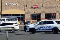 Henderson police officers investigate a fatal shooting in the Walmart parking lot at Eastgate P ...