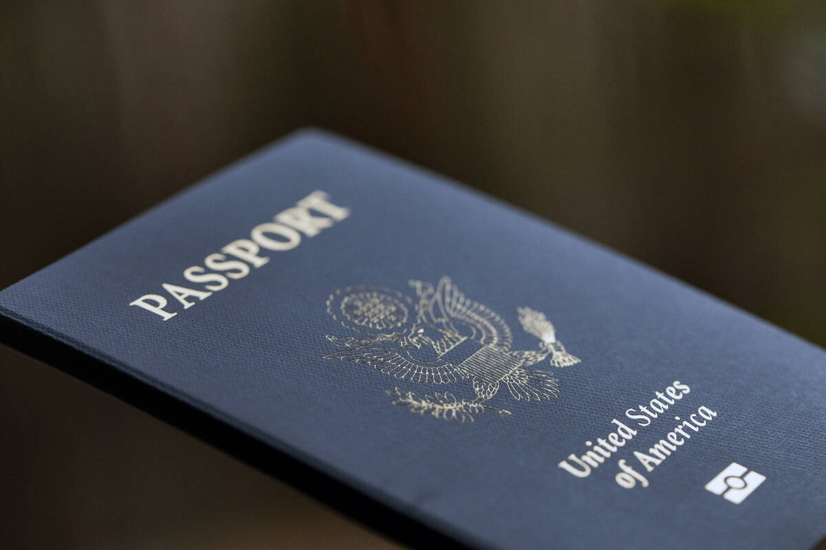 The cover of a U.S. passport is displayed in Tigard, Ore., Dec. 11, 2021. The State Department ...