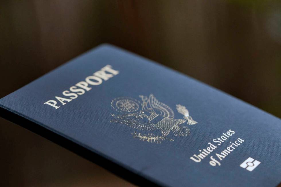 The cover of a U.S. passport is displayed in Tigard, Ore., Dec. 11, 2021. The State Department ...