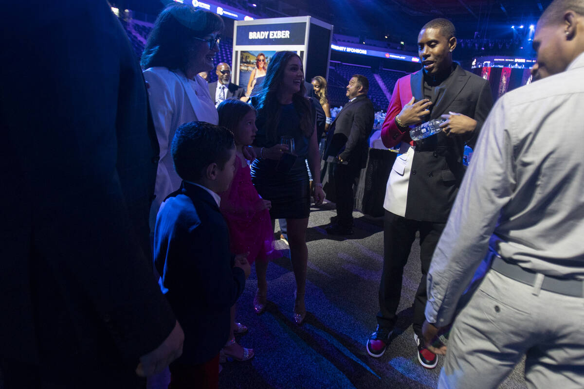 C.J. Watson, right, talks to young attendees during the Southern Nevada Sports Hall of Fame ind ...
