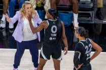 Aces head coach Becky Hammon is unhappy with guard Jackie Young (0) as they face the New York L ...