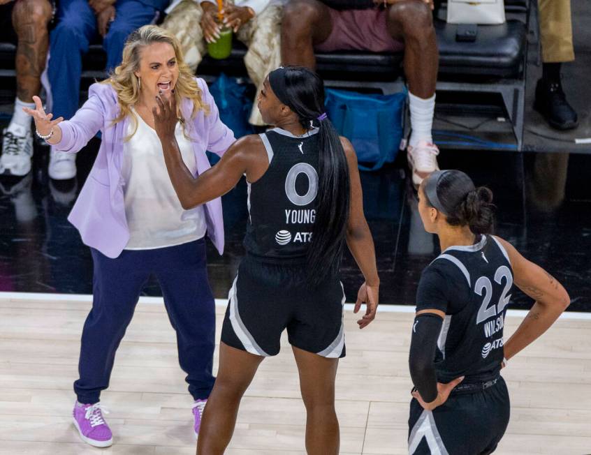 Aces head coach Becky Hammon is unhappy with guard Jackie Young (0) as they face the New York L ...