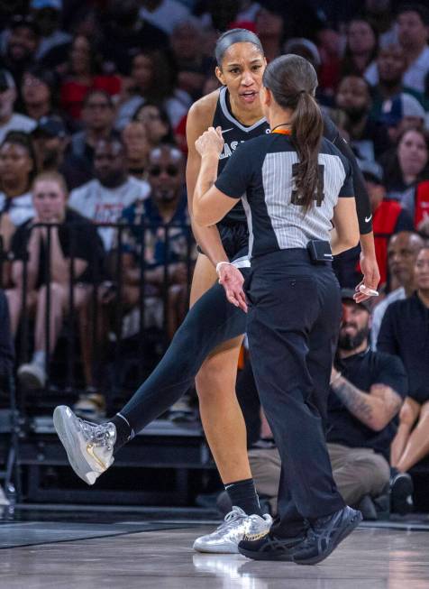 Aces center A'ja Wilson (22) appeals a foul to an official against the New York Liberty during ...