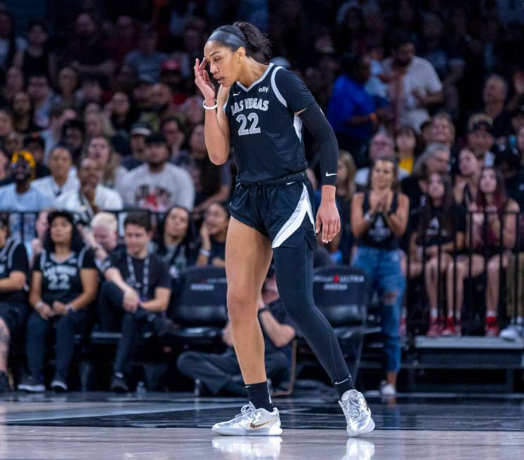 Aces center A'ja Wilson (22) walks the court dismayed against the New York Liberty during the s ...