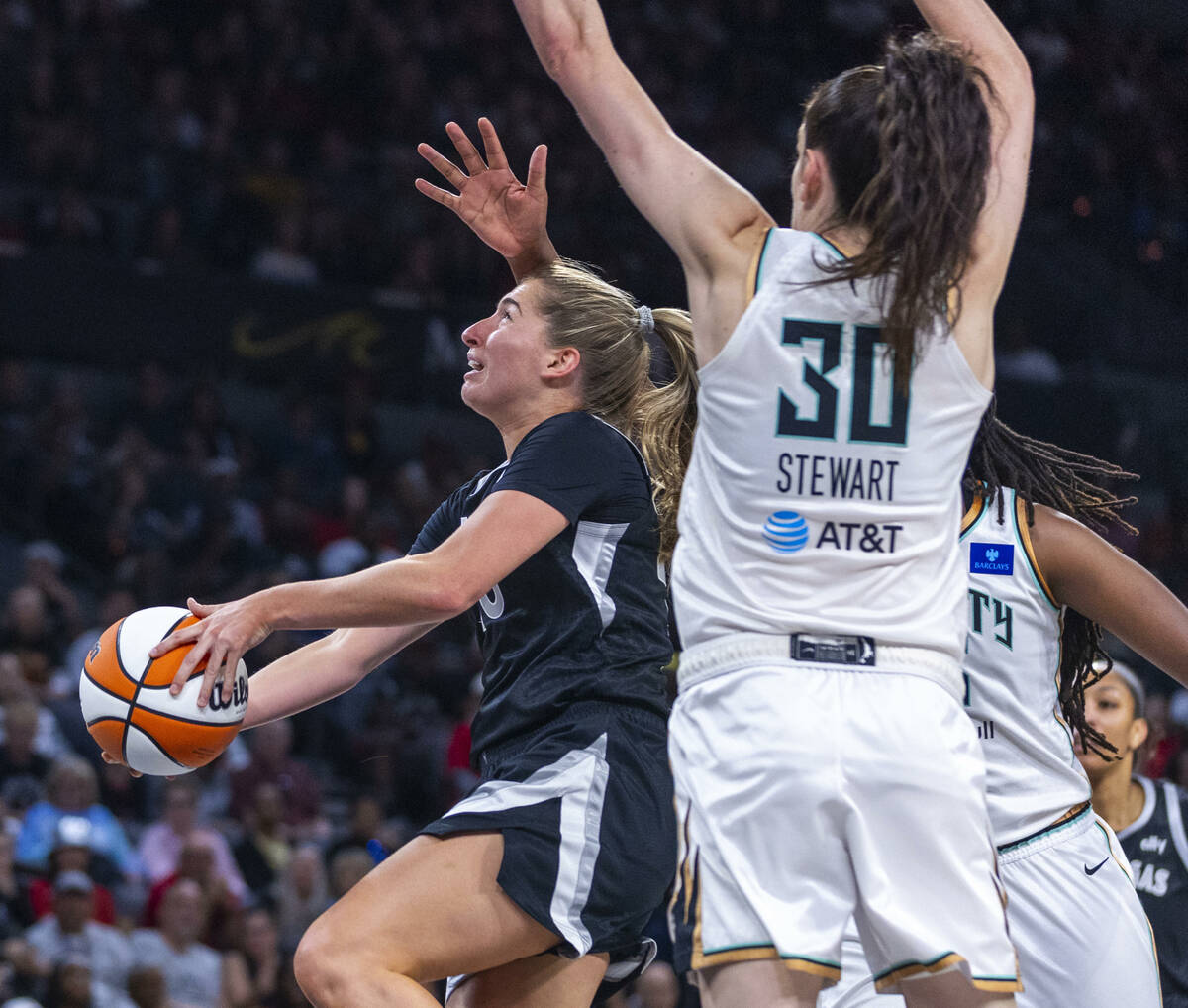 Aces guard Kate Martin (20) gets underneath the defense of New York Liberty forward Breanna Ste ...