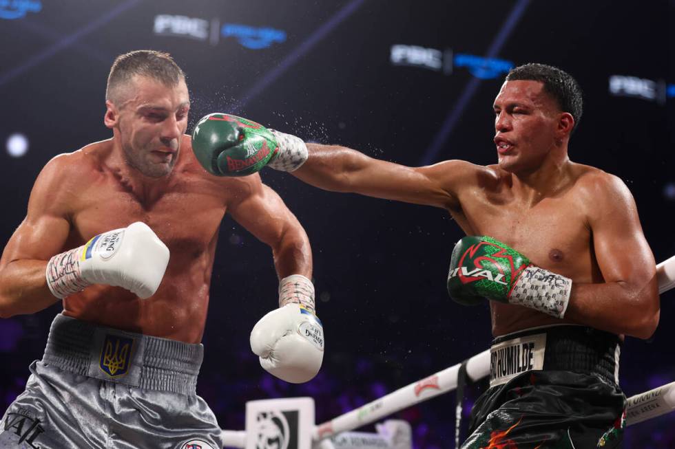 David Benavidez, right, gets a right on Oleksandr Gvozdyk during a WBC interim world light heav ...