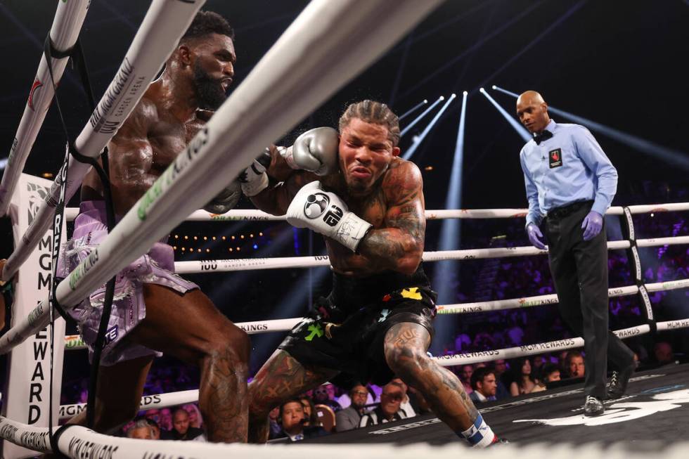 Frank Martin, left, gets a left on Gervonta “Tank” Davis during a WBA world light ...