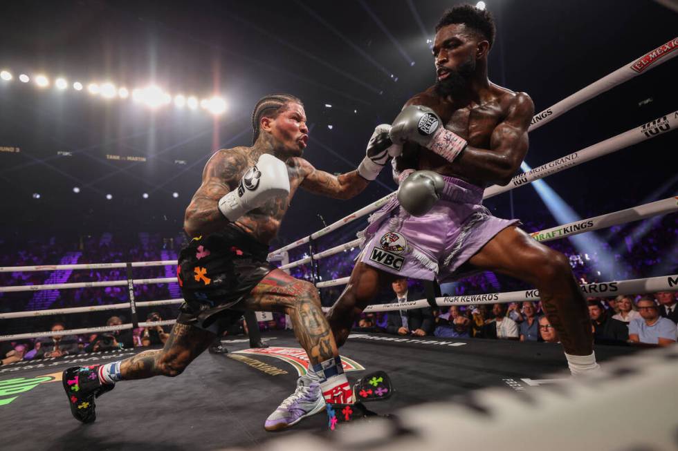 Gervonta “Tank” Davis, left, fights Frank Martin during a WBA world lightweight c ...