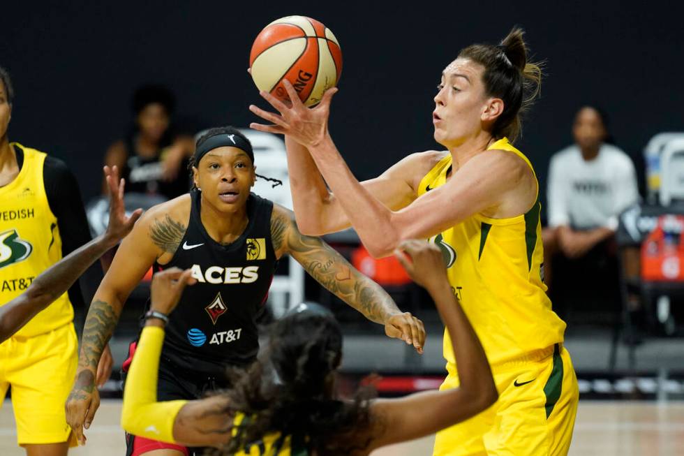 Seattle Storm forward Breanna Stewart (30) grabs a rebound away from Las Vegas Aces forward Emm ...