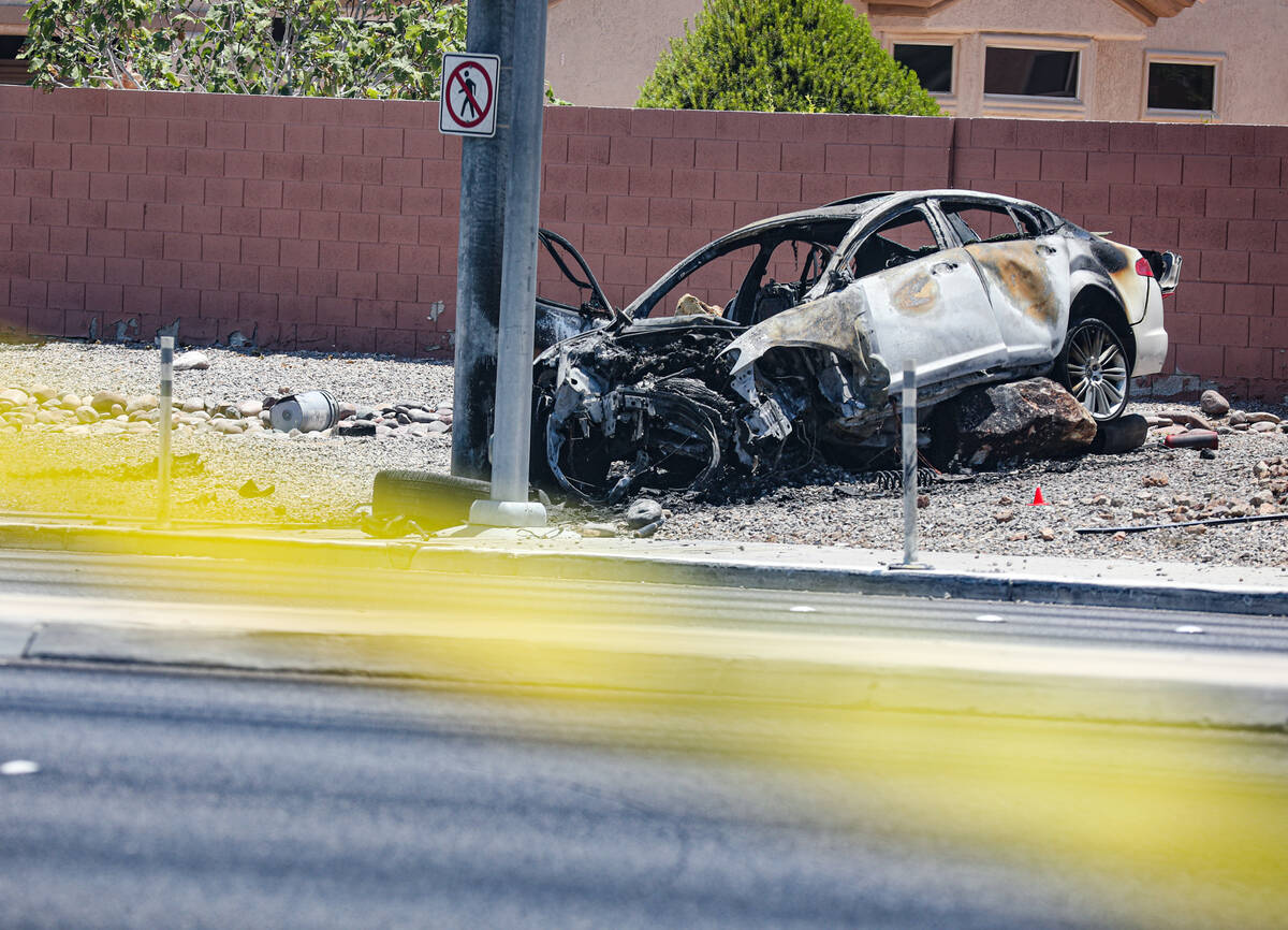 The scene where a woman died in a single car fatal crash near the 215 Beltway in Las Vegas, Sun ...