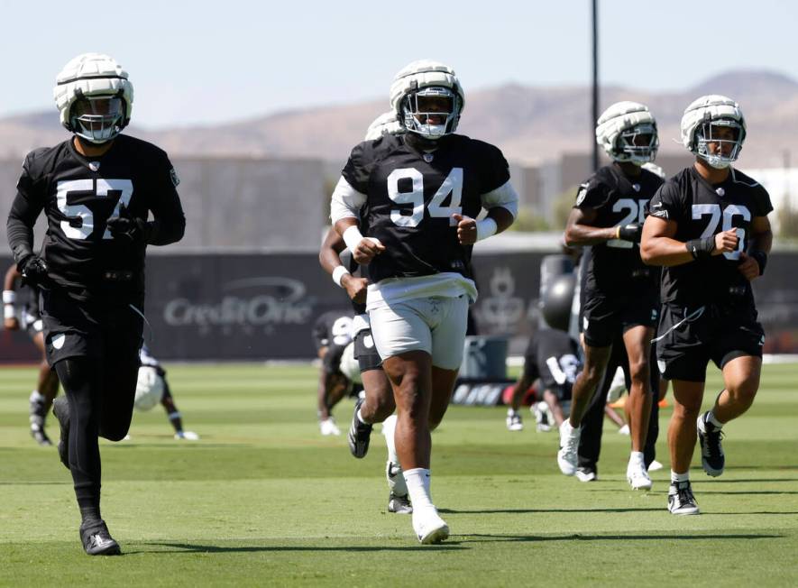 Raiders defensive tackle Christian Wilkins (94) warms up during an NFL football practice at the ...