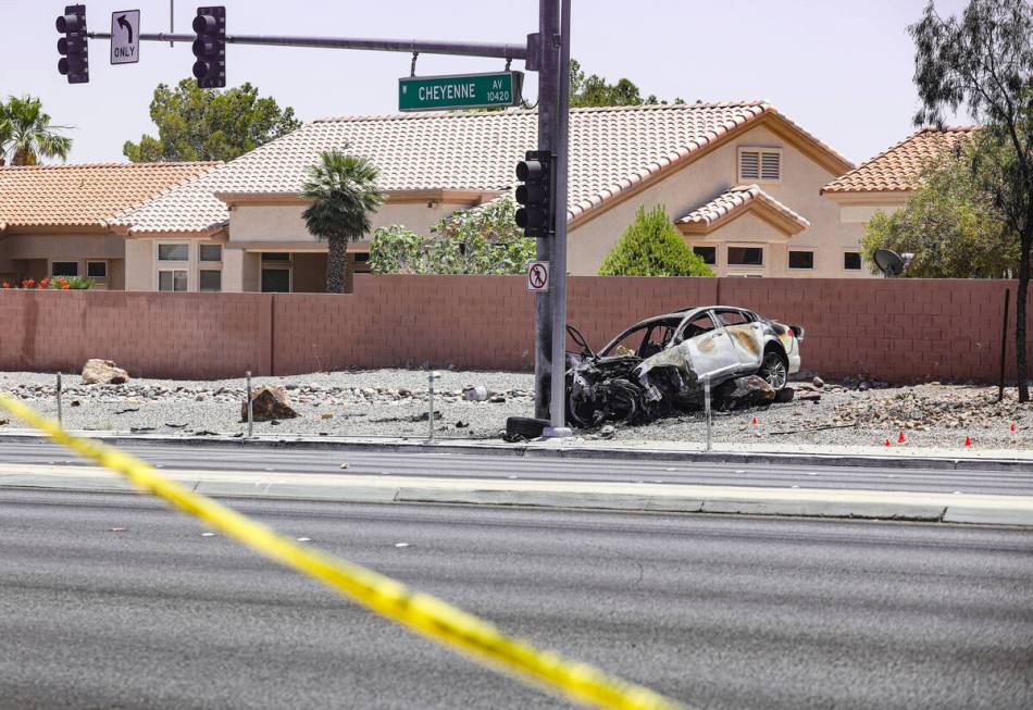 The scene where a woman died in a single car fatal crash near the 215 Beltway in Las Vegas, Sun ...