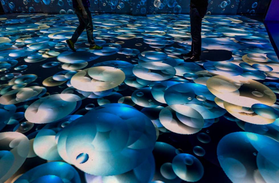 Projections of bubbles cover the floor and walls at Electric Playhouse, a new high-tech social ...