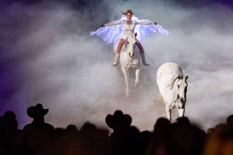 Trick and Roman rider Jessica Fowlkes follows a horse about a smoke-filled ring during a memori ...