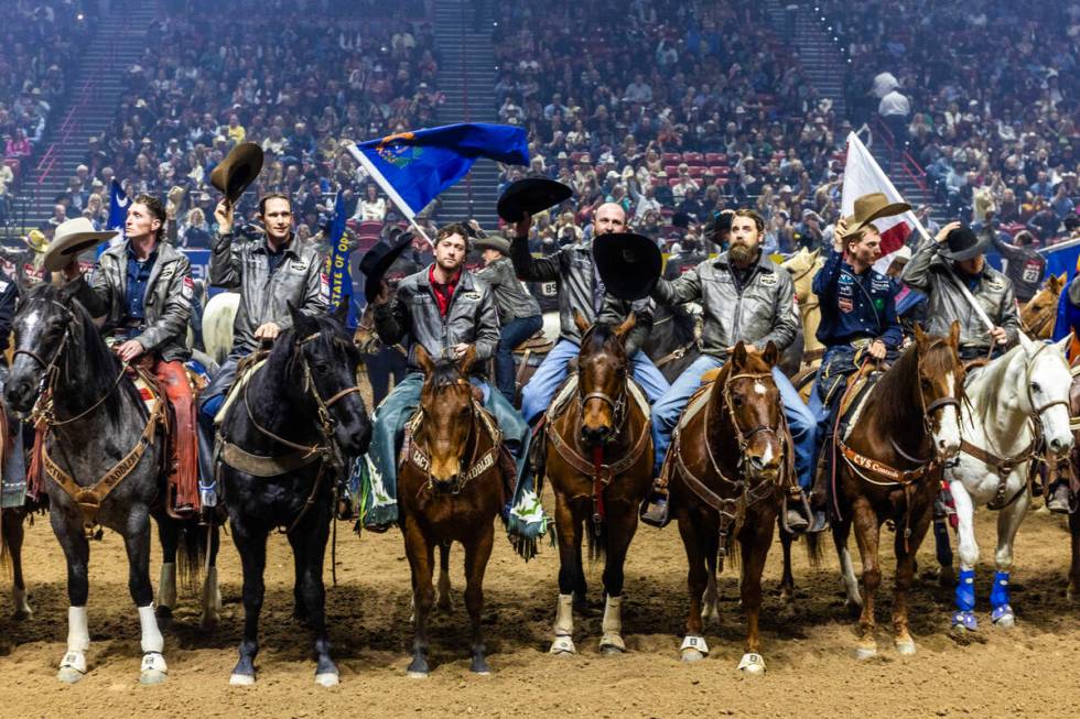 Competitors tip their hats to the fans after being introduced during the final day action of th ...