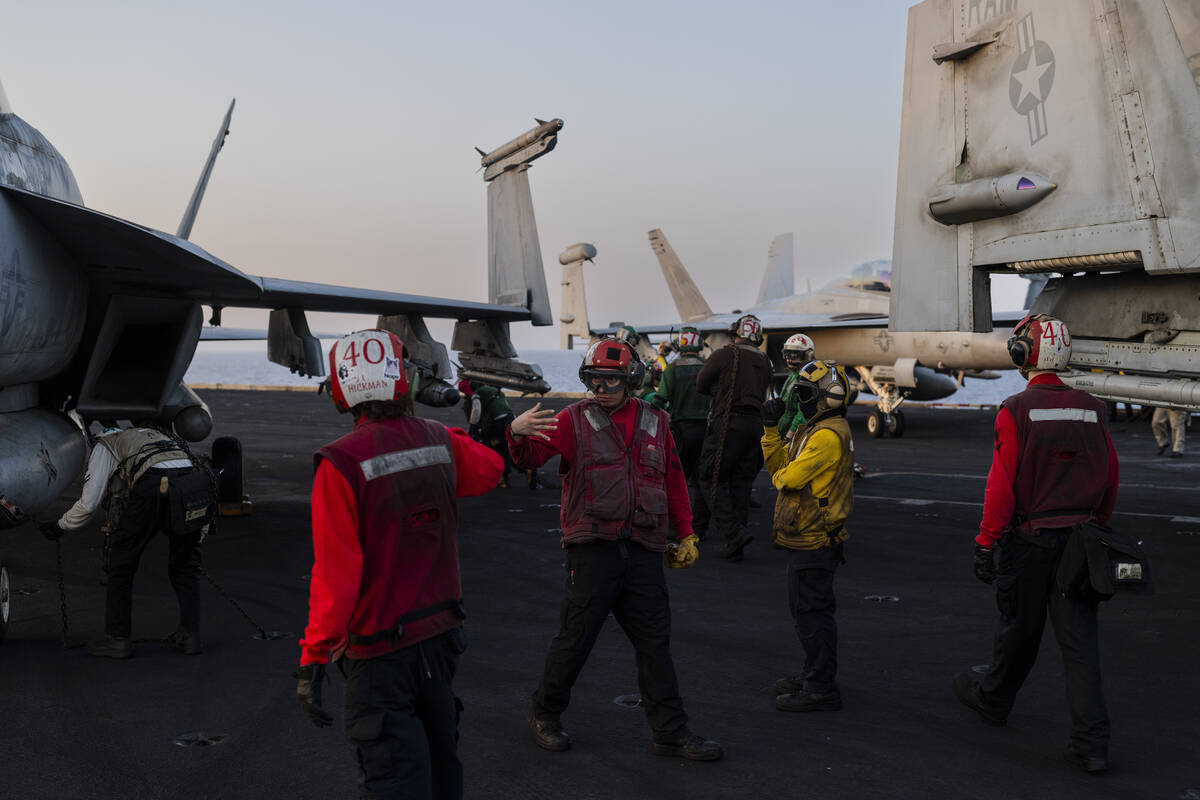 Flight deck crew members carry out takeoff operations on the USS Dwight D. Eisenhower in the Re ...