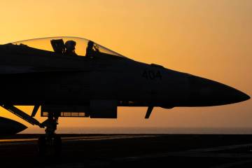 A fighter jet maneuvers on the deck of the USS Dwight D. Eisenhower in the Red Sea on Tuesday, ...
