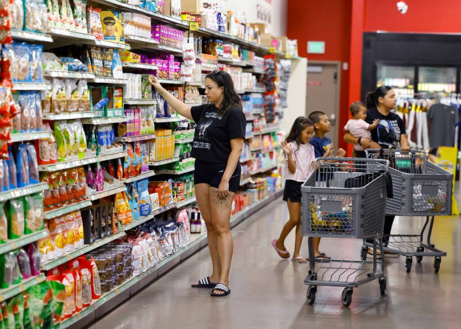 Shoppers, including Melody Jones of Las Vegas, left, shop at Grocery Outlet Bargain Market, on ...