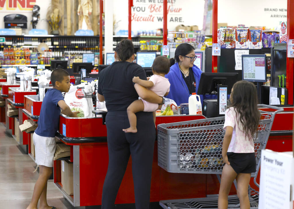 Heather Rodriguez, right, helps shoppers to checkout at Grocery Outlet Bargain Market, on Wedne ...