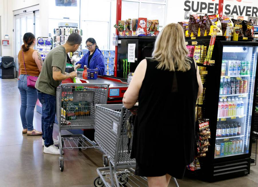 Heather Rodriguez, center, helps shoppers to checkout at Grocery Outlet Bargain Market, on Wedn ...