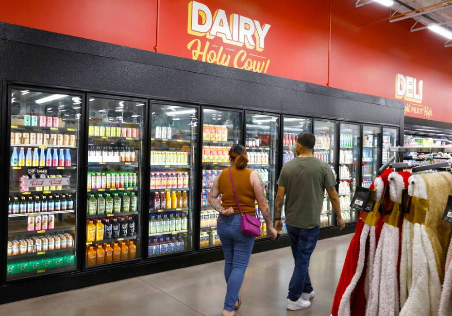 Shoppers navigate through the dairy aisle at Grocery Outlet Bargain Market, on Wednesday, June ...