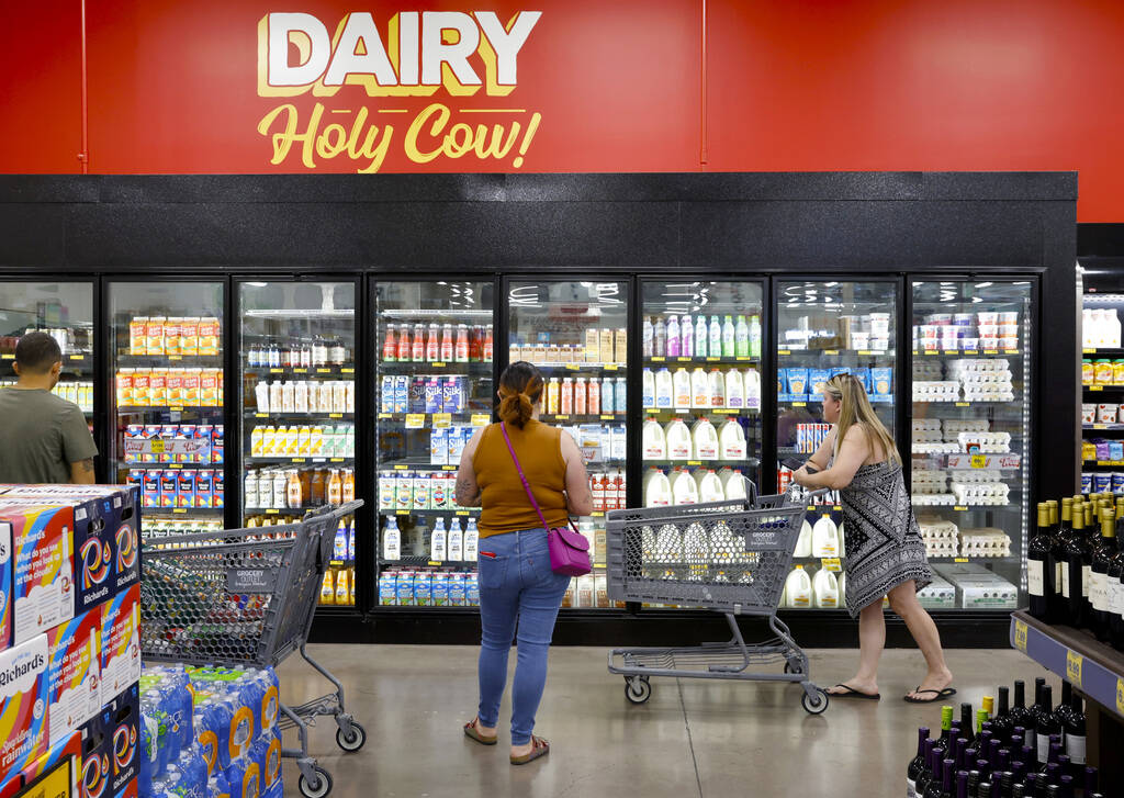 Shoppers navigate through the dairy aisle at Grocery Outlet Bargain Market, on Wednesday, June ...