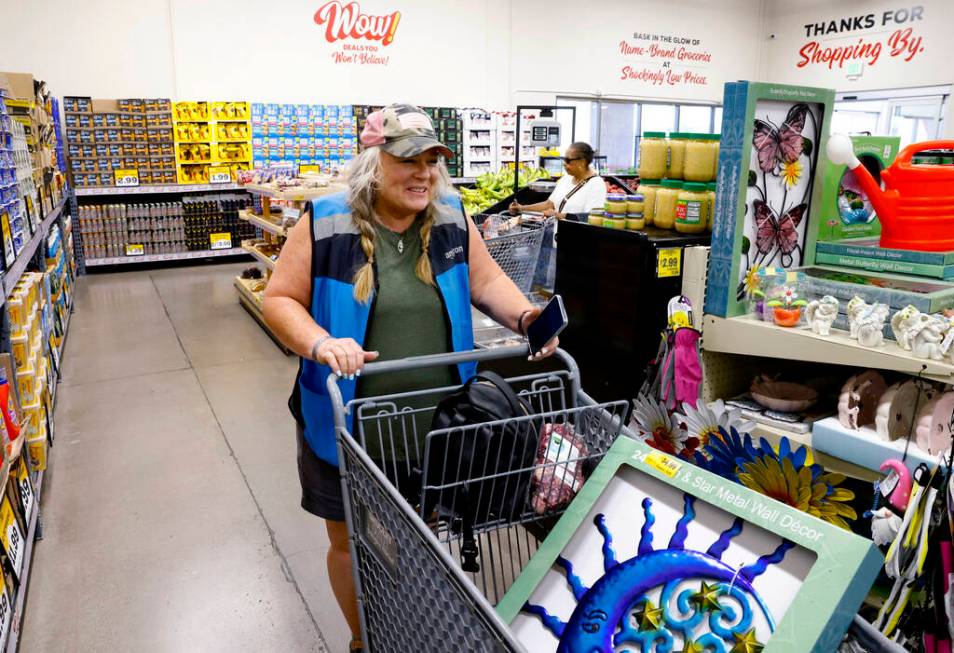 Shoppers, including Janell Jennings, left, shops at Grocery Outlet Bargain Market, on Wednesday ...