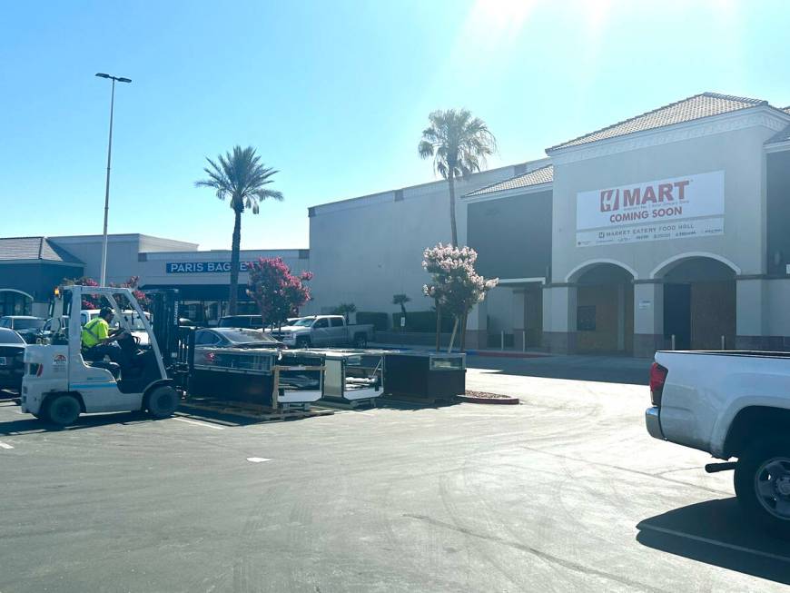 A worker bringing in what looks coolers to the H-Mart Las Vegas location which has yet to open. ...